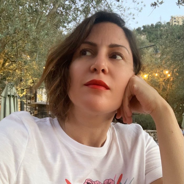 Headshot of Visiting Writer Zeina Hashem Beck on a casual background.