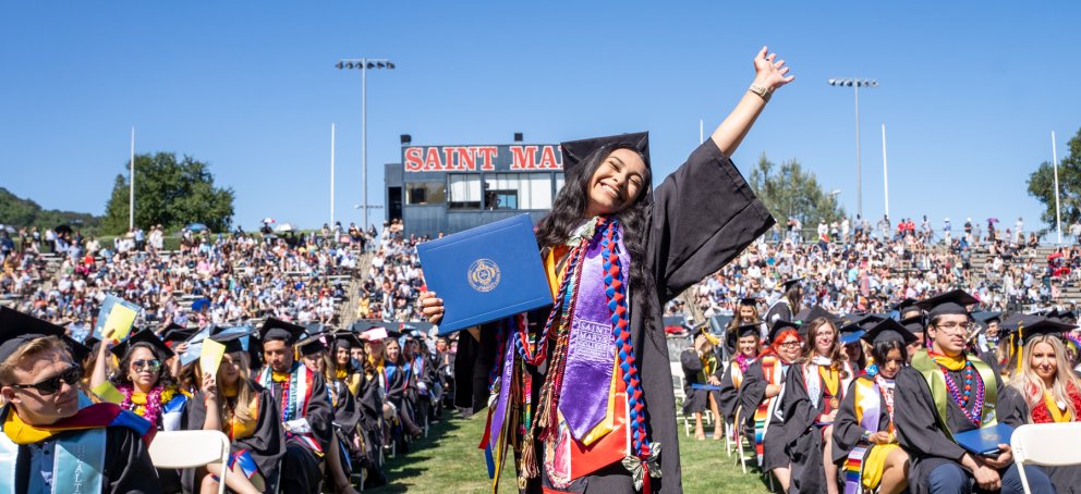 A student celebrating at Saint Mary's College Commencement